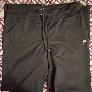 Fila Boot Cut Mid-Rise Pants with drawstring. Small tear on bottom hem